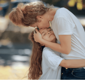 A person hugging their child