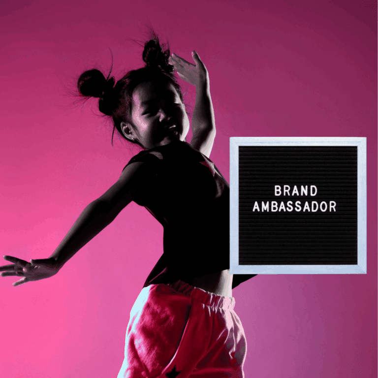 Photo of a little girl and a sign that says brand ambassador
