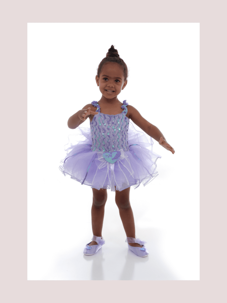 A photo of a little girl in a tutu ready for recital